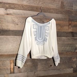 NG the label white blouse with blue design